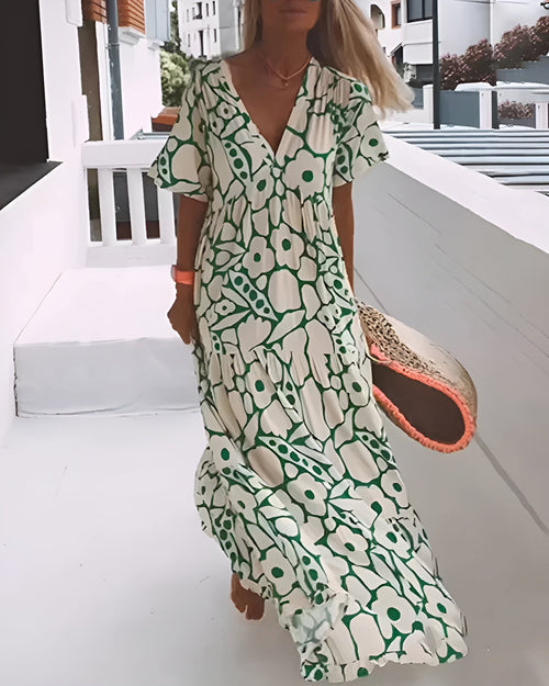 CHRISTINE | Lang sommerkjole med flagrende snitt og elegant grafisk mønster